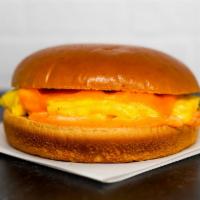 Brioche, Egg, & Cheddar Sandwich · 2 scrambled eggs, melted Cheddar cheese, and Sriracha aioli on a warm brioche bun.