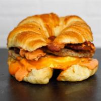 Croissant Meat Lovers Breakfast Sandwich · 2 scrambled eggs, melted Cheddar cheese, smoked
bacon, breakfast sausage, and Sriracha aioli...
