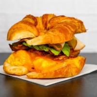 Croissant, Turkey Bacon, Turkey, Avocado, Egg, & Cheddar Sandwich · 2 scrambled eggs, melted Cheddar cheese, crispy bacon, sliced smoked turkey, avocado, and Sr...