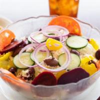 Greek · Feta, beets, pitted olives, onion, mild peppers, tomato, cucumber served with our own home-m...