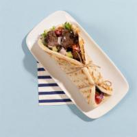 Beef Soulvaki Pita · Grilled beef skewer wrapped in a pita with lettuce, tomato, onion, and tzatziki.