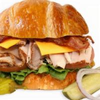 Turkey Club With Bacon Sandwich On A Croissant · 