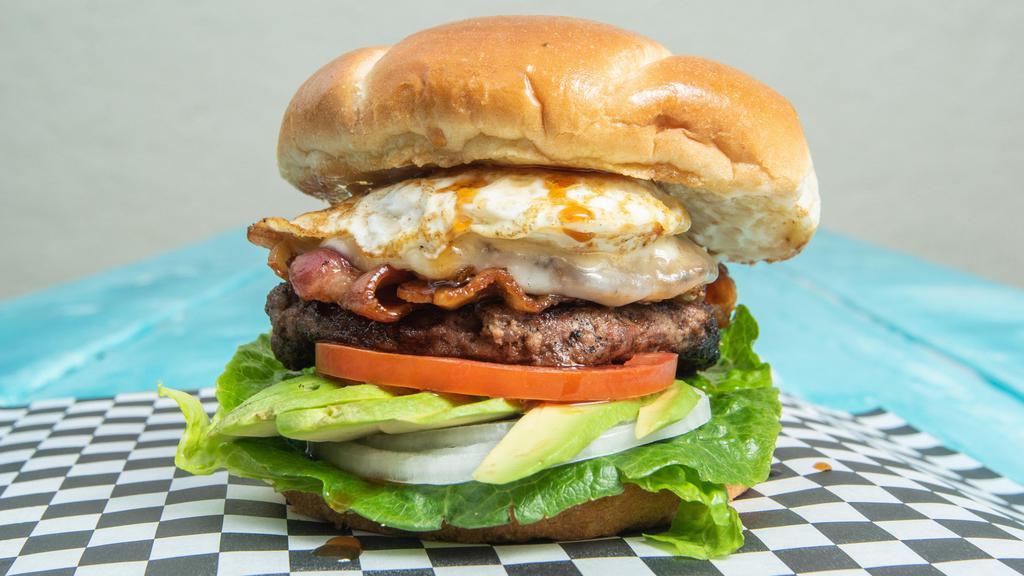 Pocket Burger · 1/3 lb seasoned fresh beef patty, avocado, fried egg, bacon, provolone cheese , our signature Pocket sauce, lettuce, tomato, onion, and mayo, on a  buttered Brioche  bun. Served with seasoned French fries.
