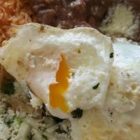 Chile Relleno Preparado · Cheese stuffed poblano pepper that's topped with chile rojo sauce & cheese