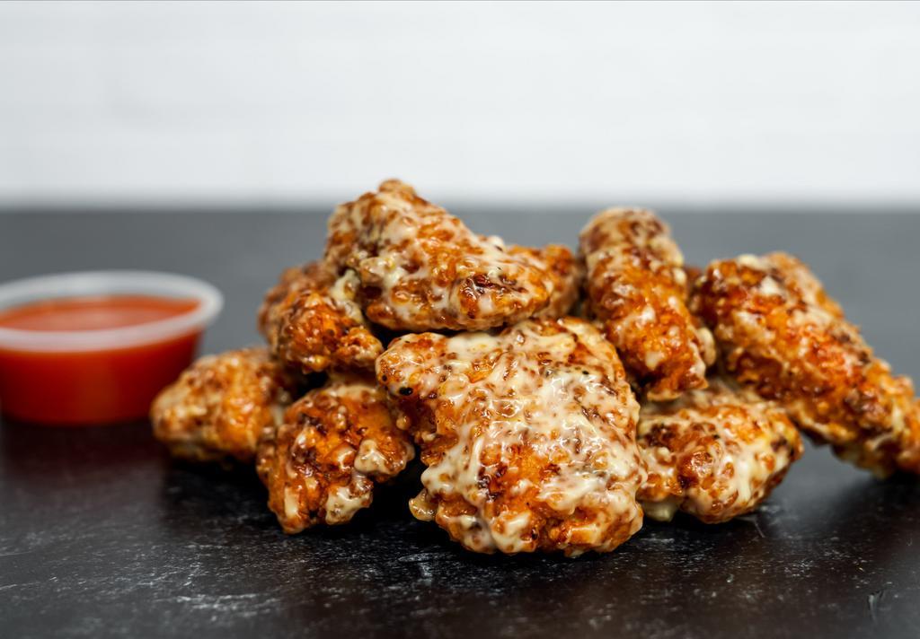12 Crispy Boneless Wings · 12 Crispy boneless chicken wings tossed in sauce and served with homemade buttermilk ranch, honey mustard, or blue cheese dressing