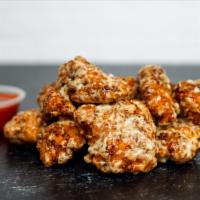 8 Crispy Boneless Wings  · 8 Crispy boneless chicken wings tossed in 1 wing flavor and served with fresh carrot & celer...