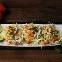 Fish Taco  · Fried Tilapia Fish, Topped with or homemade Chipotle sauce, cabbage, onion, tomato, and cila...