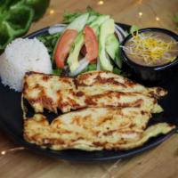 Pechuga A La Plancha  · Chicken marinated with orange juice and spices, grilled to perfection.