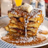 Pb+J Cornflake French Toast · classic pb+j sandwich with grape jelly, dipped in french toast batter, crusted in cornflakes...