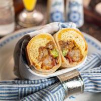 The Venice Breakfast Burrito · flour tortilla rolled up + stuffed with 2 eggs scrambled, nitrate free bacon, cheddar cheese...