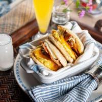 The American Stand By (2) · 2 english muffins with bacon, cheddar, egg, lemon herb aioli