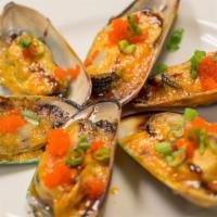 Baked Green Mussels · Baked with creamy sauce and topped scallions.