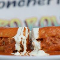 Lonches Gemma · Bolillo roll stuffed with pork meat, prepared cream sauce, american cheese, smothered in chi...