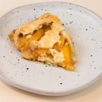Peach Pie By The Slice  · Premium sliced peaches in a flaky crust.