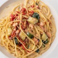 Linguine Al Salmone · Pasta with smoked salmon, diced zucchini, red bell pepper and shallots in a white wine cream...