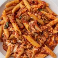 Penne Alla Paesana · Pasta with tomato sauce, grilled eggplant, garlic, fresh basil and mozzarella cheese.