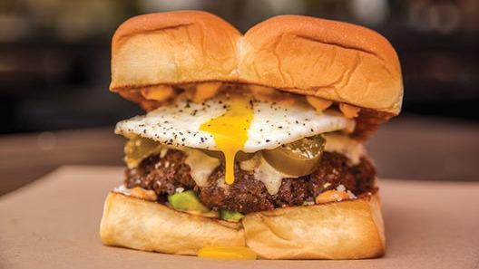 Little Mule Burger · White American cheese, avocado, pickled jalapenos, cotija cheese, fried egg, and chipotle aioli on a King's Hawaiian roll.