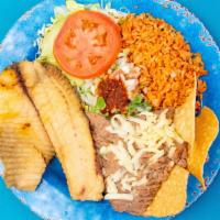 Fish Combo Plate · Tilapia fish served with cooked beans, Mexican style tomato rice, fresh guacamole with Hass ...