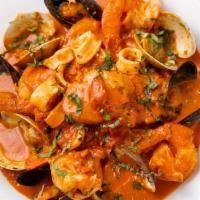 Seafood Combo Pasta · Fresh clams, mussels, calamari, shrimp and scallops in a spicy fra diavolo sauce homemade li...