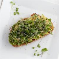 Avocado, Truffle Oil, Micro Greens · Freshly baked sourdough bread topped off with avocado slices, truffle oil, and micro greens....