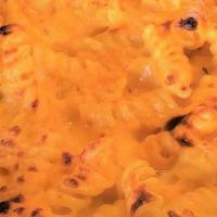 Mac+Cheese (V) · a cheesy dish of baked rotini pasta, cheddar cheese sauce, alfredo sauce and shredded chedda...