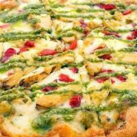 Basil Pesto Chicken Pizza · basil pesto sauce, shredded mozzarella, roasted red peppers, fire braised chicken, topped wi...