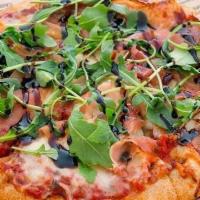 Prosciutto + Arugula Pizza · house made red sauce, shredded mozzarella, shredded parmesan, hormone free prosciutto, finis...