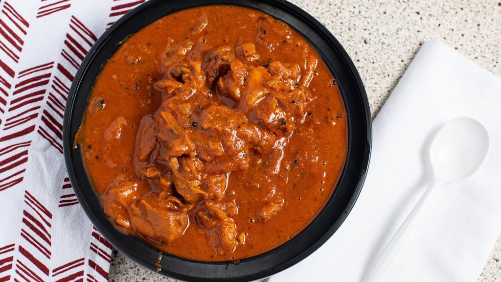 Curry · Medium spicy - authentic Indian curry choice of meat (chicken, lamb, goat or beef) with our curry sauce which includes crushed tomato, onion, and our house blend of spices.