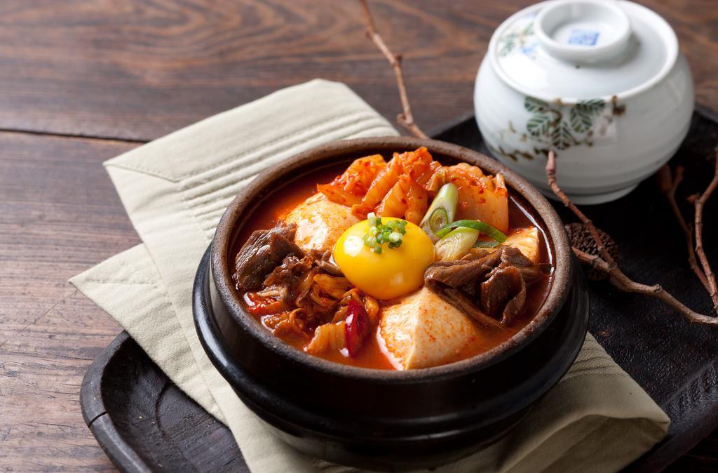 Kimchi Tofu Soup · Served with Pork, Beef, or without.