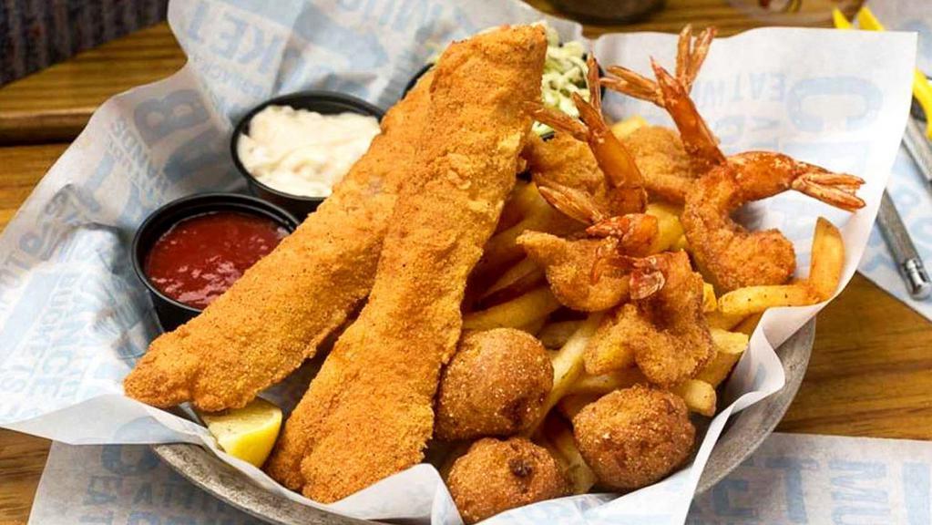 Shrimp And Fish · Crispy fried shrimp and fish fillet with fries, coleslaw and hushpuppies.