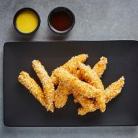 Crispy Rice Chicken Strip · Marinated chicken breast strips fried in our special rice flour, crunchy outside, tender ins...