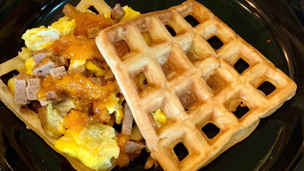 Waffle Egg Sandwich · Scrambled eggs and  turkey sausage piled on two large waffles topped with cheddar cheese. Served with a mandarin orange sauce (or compote).