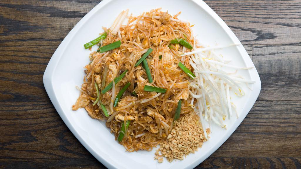 Pad Thai · Traditional Thai dish of stir-fried thin rice noodle with egg, bean sprouts, scallion, bean curd and crushed peanut.