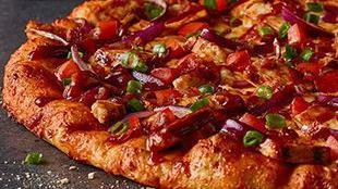 Bbq Chicken Pizza · Backyard BBQ meets handmade pizza grilled white meat chicken, bacon, cheddar, tomatoes, red ...