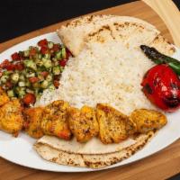 #11 Chicken Kabob Boneless · Juicy Chicken Pieces - Served with Rice, Pita Bread, Shirazi Salad, Grilled Tomatoes and Pep...