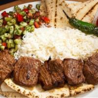#13 Beef Shish Kabob · Tender Beef Sirloin served with Rice, Pita Bread, Shirazi Salad, Grilled Tomatoes and Peppers