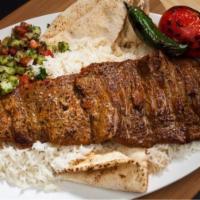 #16 Chelo Kabob Barg (Filet) · Our most tender beef served with Rice, Pita Bread, Shirazi Salad, Grilled Tomatoes and Peppers