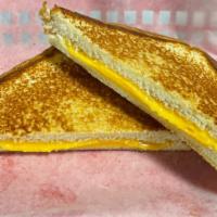 Grilled Cheese · The Classic - just like Mom made.  Grilled American cheese on Texas Toast.