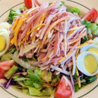 Chef'S Salad · Ham, turkey breast, tomato, hard boiled egg, and cheese served on a bed of crisp lettuce. Se...