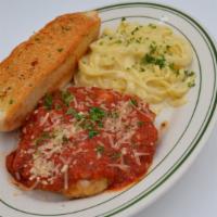Chicken Parmesan · A tender breaded chicken breast topped with Swiss cheese, and marinara sauce. Served with sp...