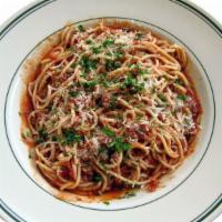 Spaghetti · Spaghetti tossed in our spaghetti sauce, topped with parmesan cheese and sprikled with chopp...