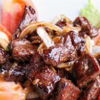 Sizzling Filet Mignon · On an onion, lettuce and tomato salad. With fried rice add$2.95
