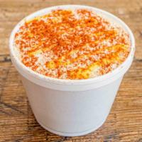 Esquites · Corn in a cup, topped with mayo, cotija cheese, butter, chile powder.