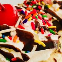 Banana Split · Pick any three flavor of ice cream, served with a banana split in 1/2 topped with whip cream...