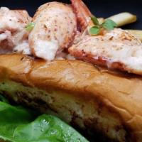 The Lobster Roll · Maine lobster, old bay aioli, touch of lemon, celery topped with crispy onion on a butter ro...