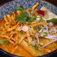 Khao Soi - Coconut Curry Noodle · Chicken drumstick, egg noodles, blend of yellow and red curry spices, chili oil, coconut mil...