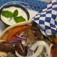 Gyros Sandwich · Thinly sliced beef and lamb cooked on a rotisserie served in a pita with onions, tomatoes an...