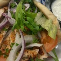 Chicken Souvlaki Sandwich · Marinated chicken tenders in a pita with lettuce, tomatoes, pickles and onions.