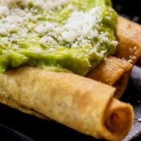 Rolled Tacos (3) · With guacamole or sour cream and topped with cotija cheese.