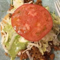 Regular · Choice of meat with refried beans, lettuce, sour cream, guacamole, cheese, salsa and tomatoes.